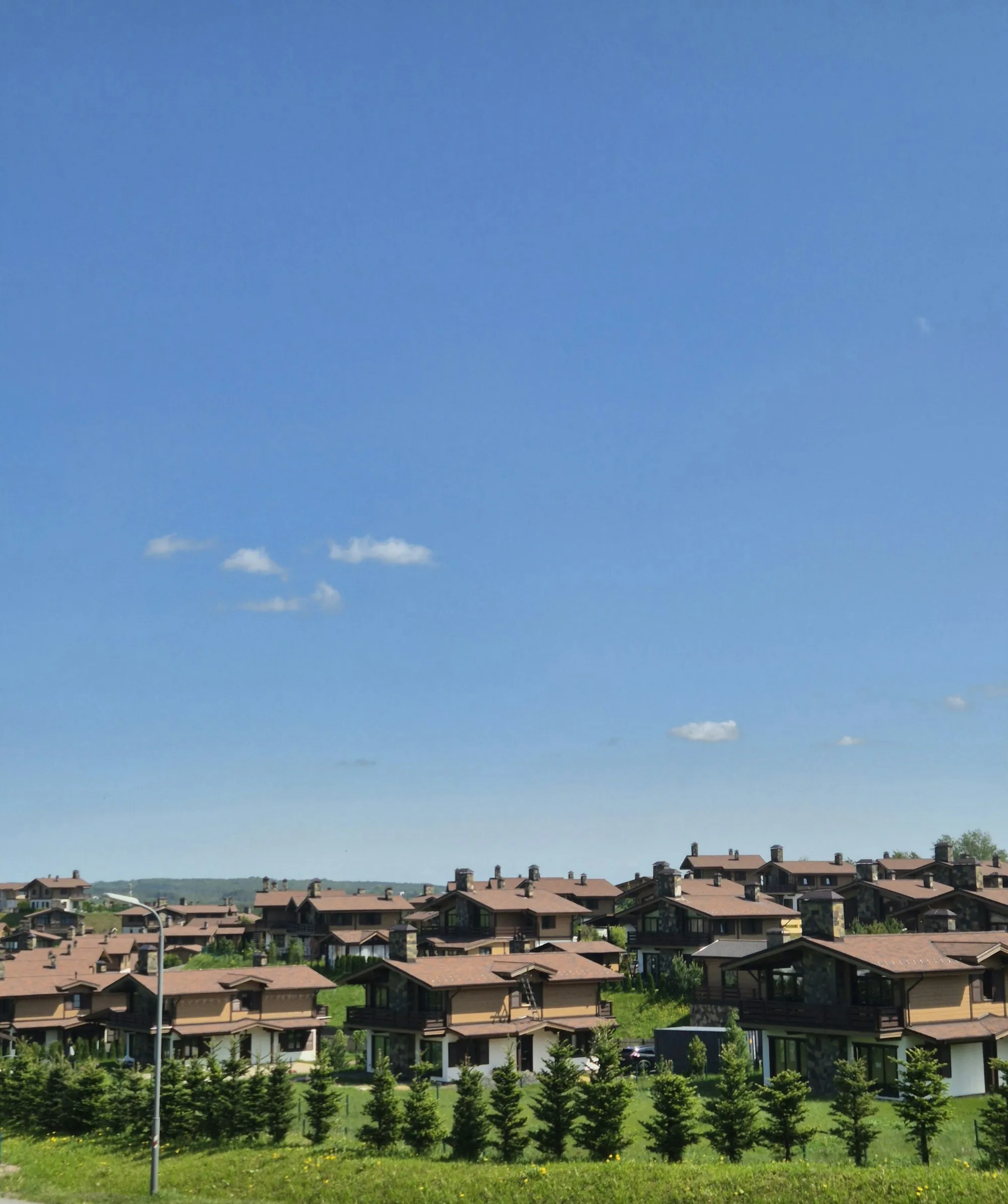 Rooftops of a residential neighbourhood under a clear sky